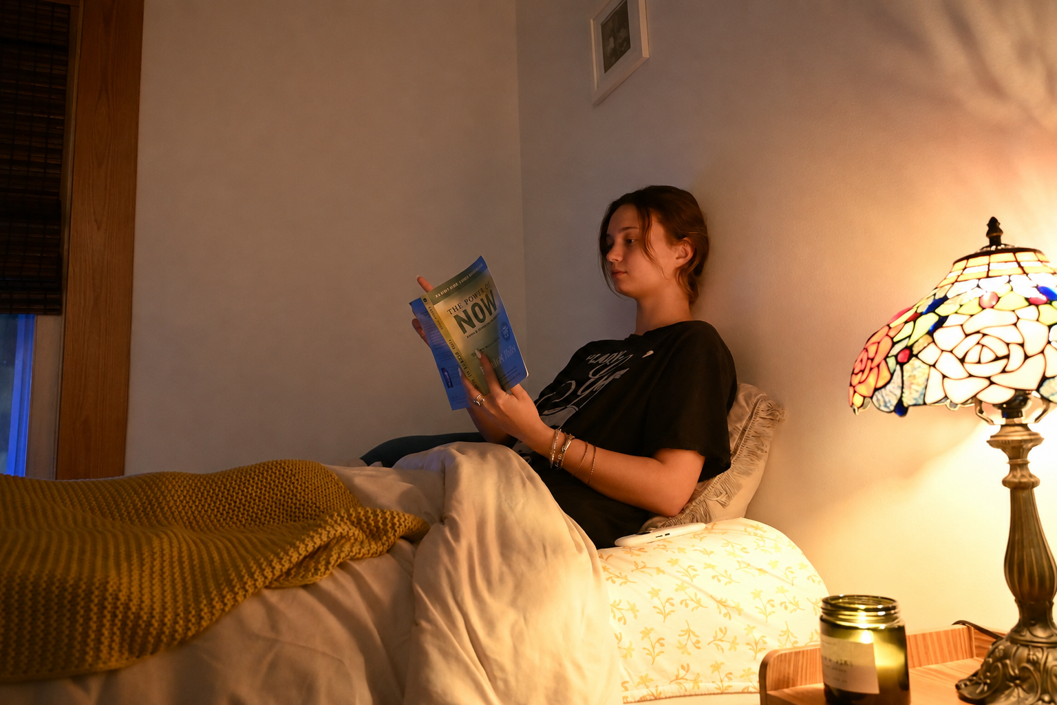 Person reading in warm light as part of an evening wind-down routine