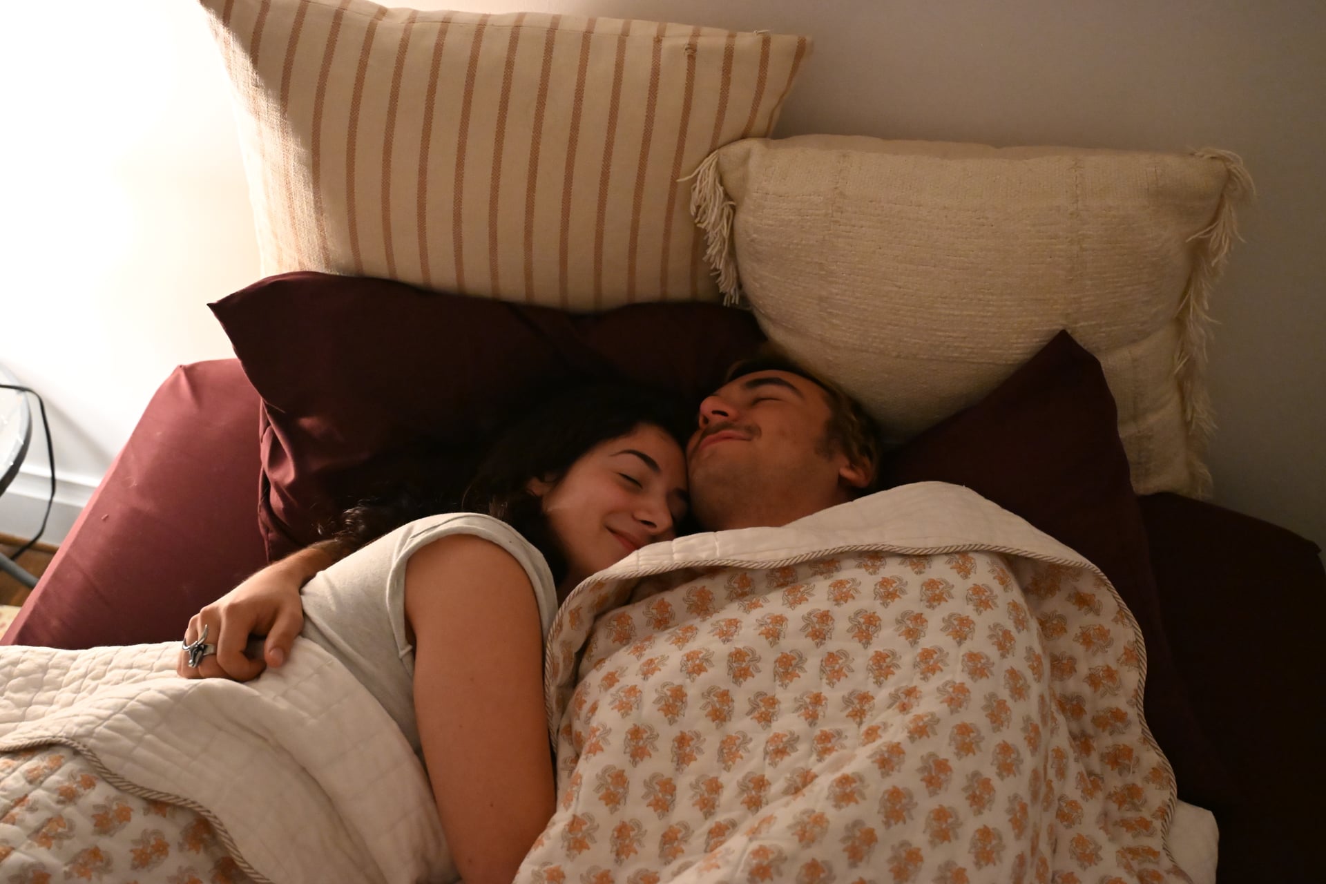 A couple sleeping peacefully side by side, undisturbed
