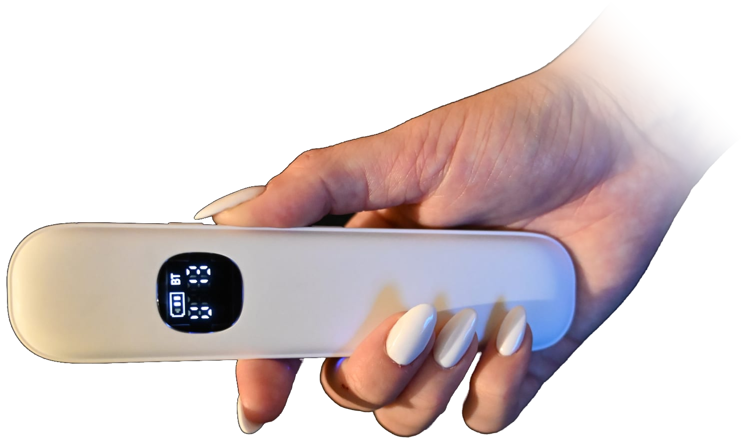 A white Lullabar held in one hand, its small display lit.